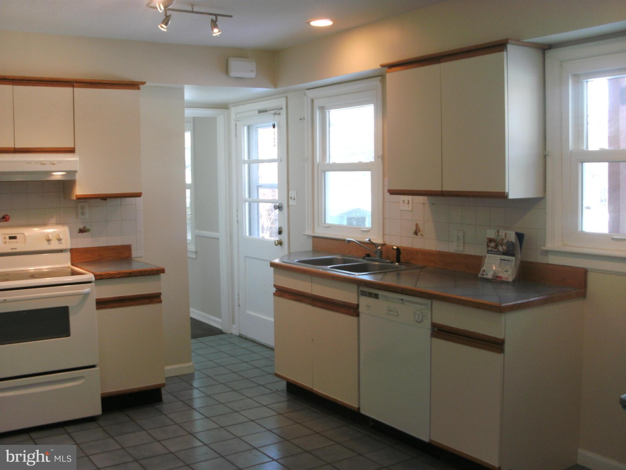 8801 Littlewood Road Baltimore, MD 21234 - Photo 8 of 17 a kitchen with stainless steel appliances granite countertop a sink and a stove