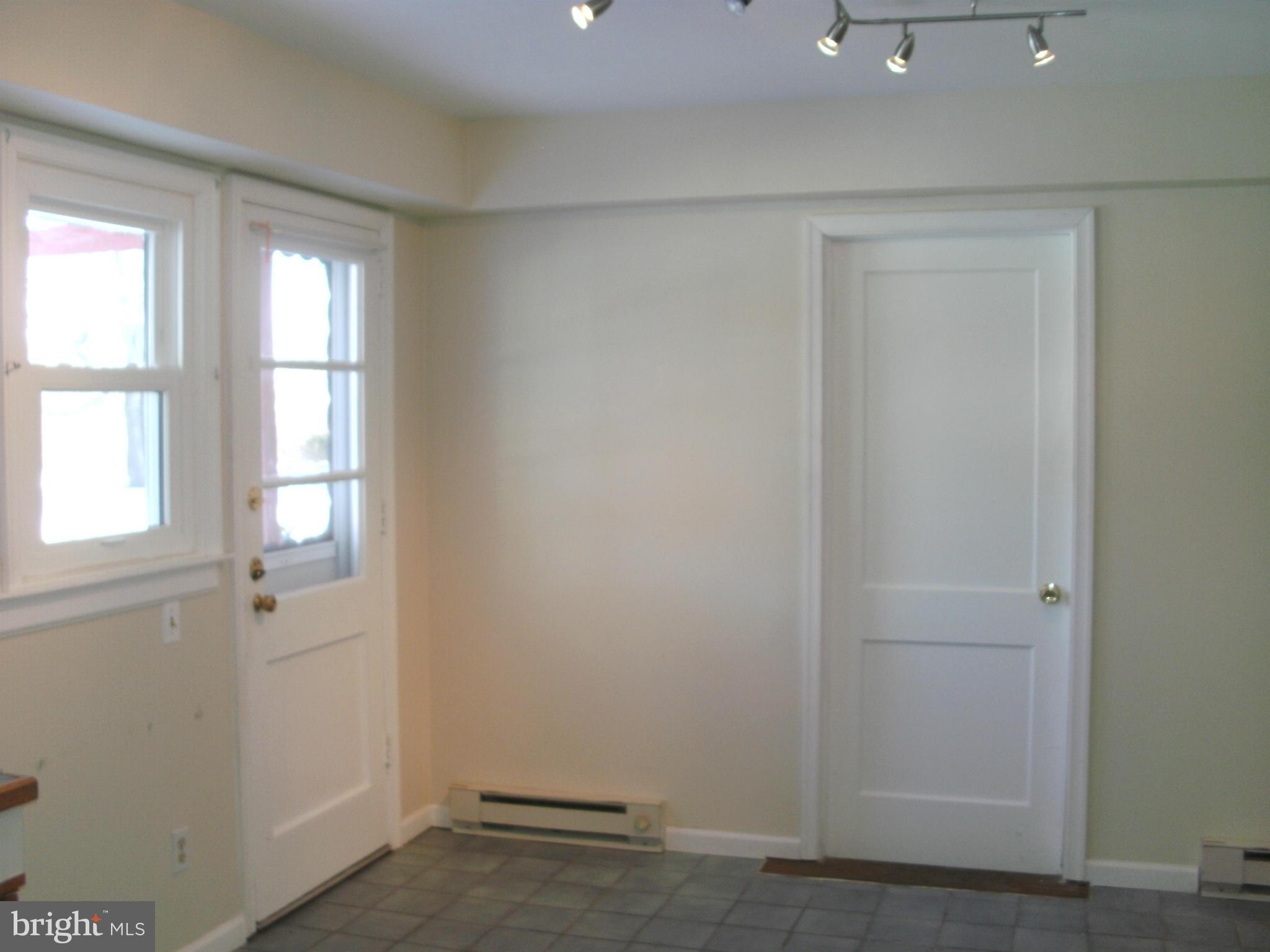 8801 Littlewood Road Baltimore, MD 21234 - Photo 9 of 17 an empty room with windows