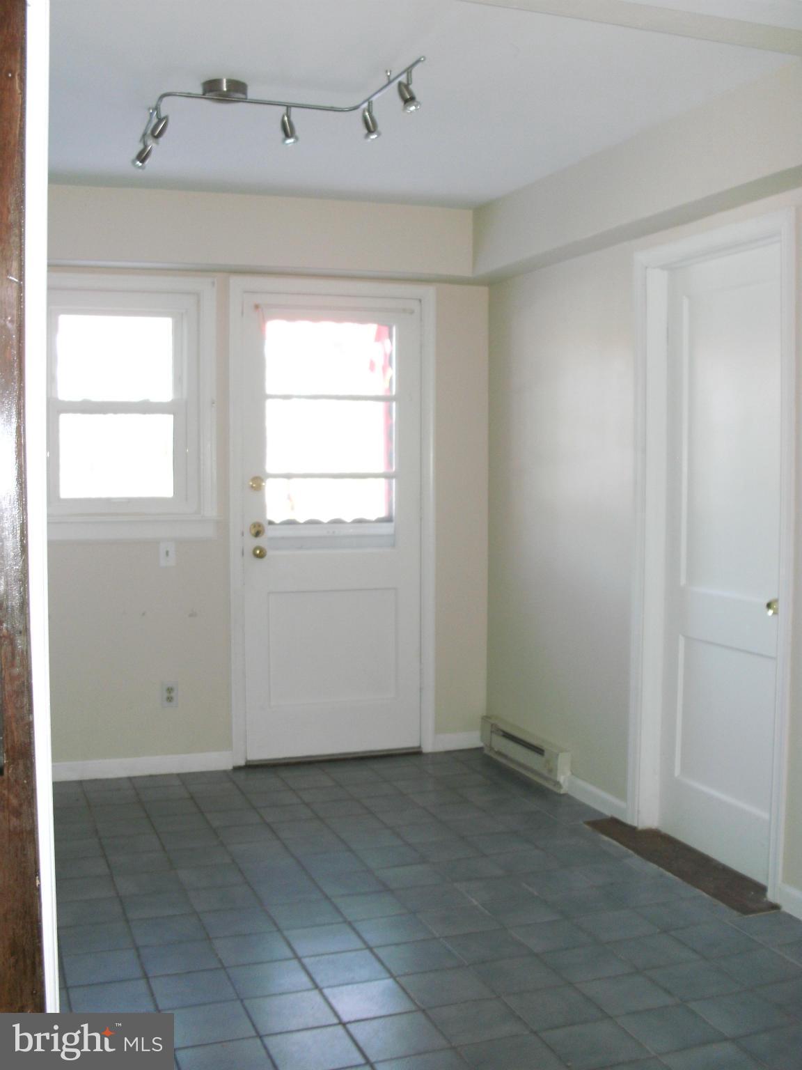 8801 Littlewood Road Baltimore, MD 21234 - Photo 10 of 17 an empty room with windows