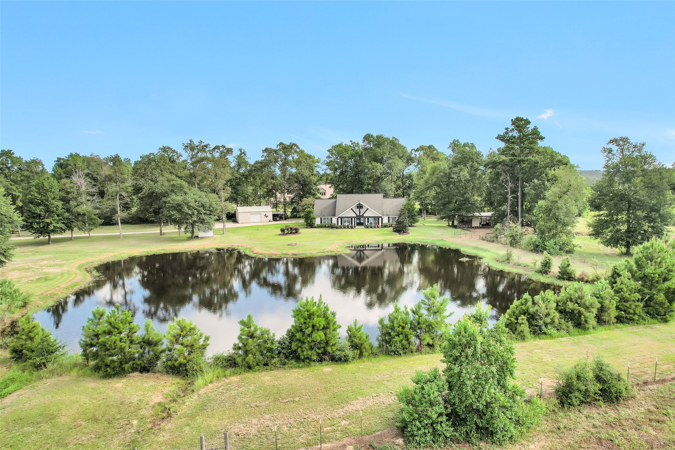 a view of a lake with houses in the back