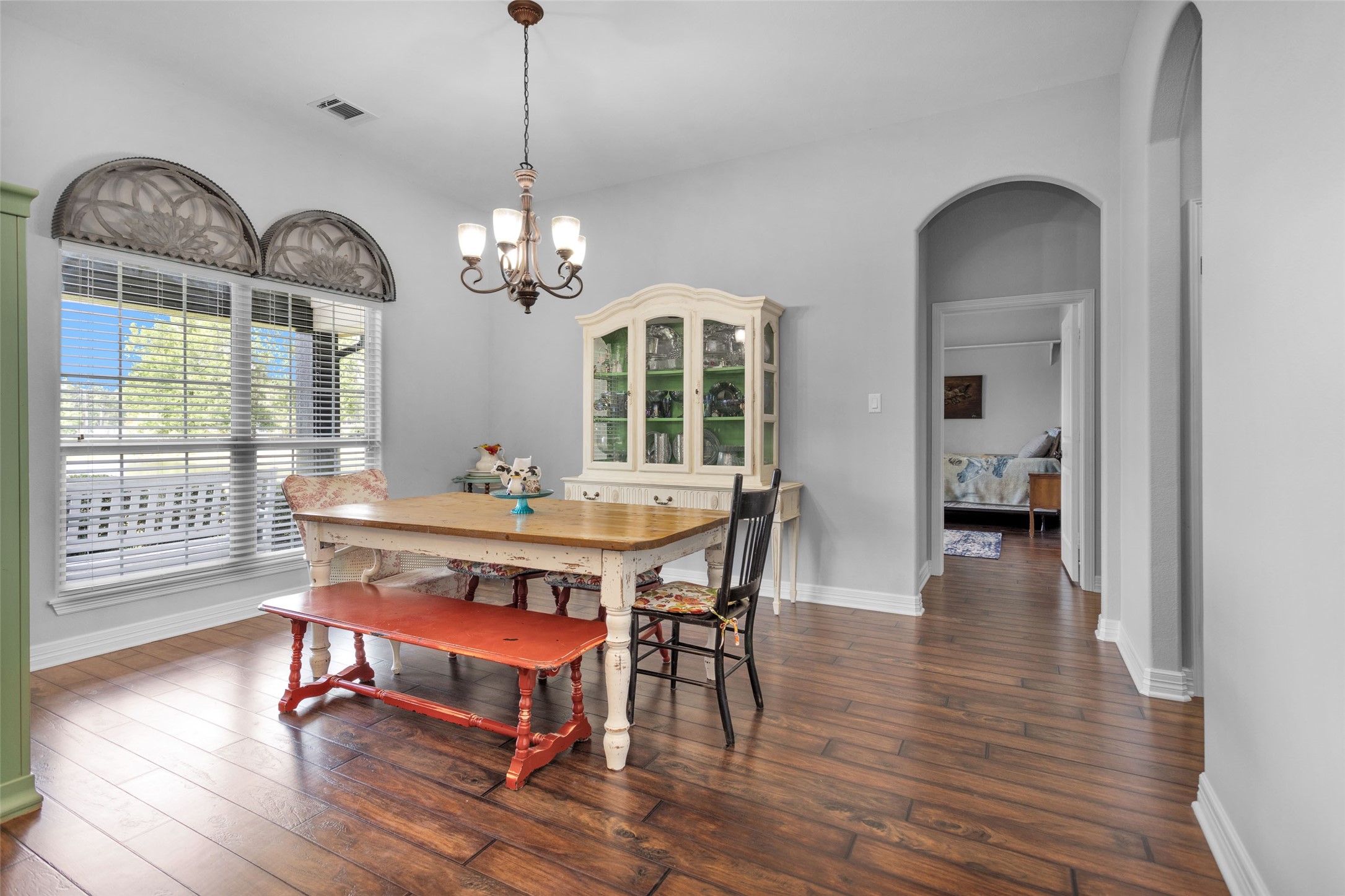 10810 Farrell Road Willis, TX 77378 - Photo 11 of 36 a view of a dining room with furniture wooden floor and a chandelier