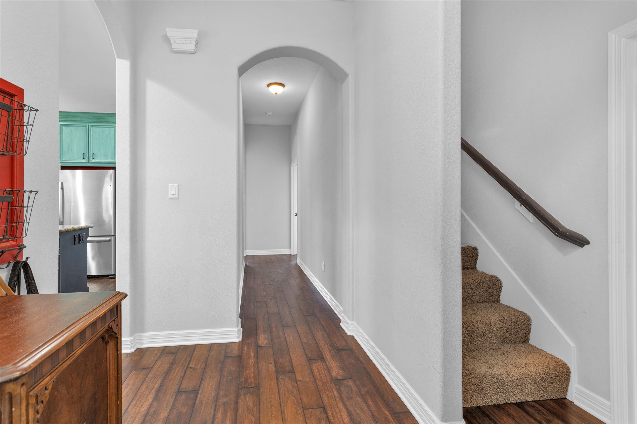 10810 Farrell Road Willis, TX 77378 - Photo 24 of 36 a view of a hallway with wooden floor and staircase