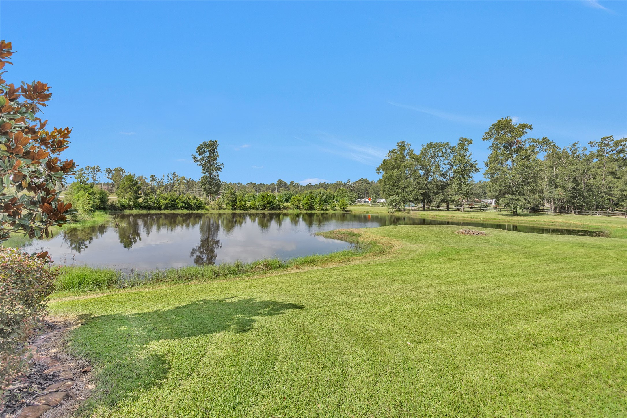 10810 Farrell Road Willis, TX 77378 - Photo 33 of 36 a view of a lake with houses in the back
