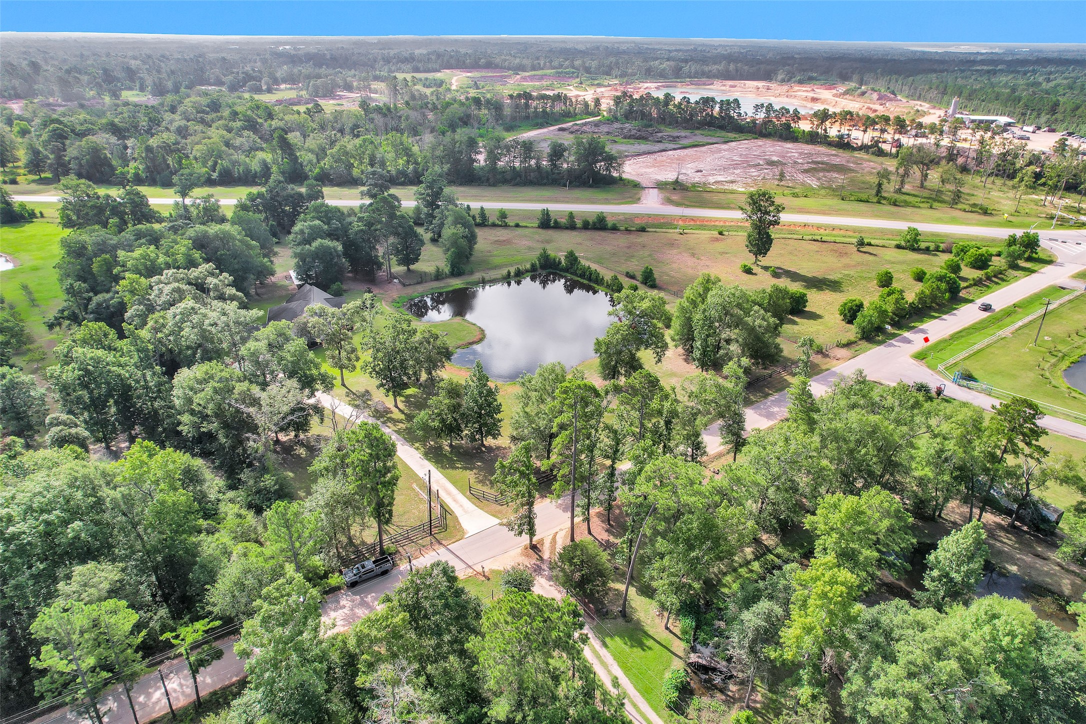 10810 Farrell Road Willis, TX 77378 - Photo 34 of 36 an aerial view of residential houses with outdoor space and swimming pool
