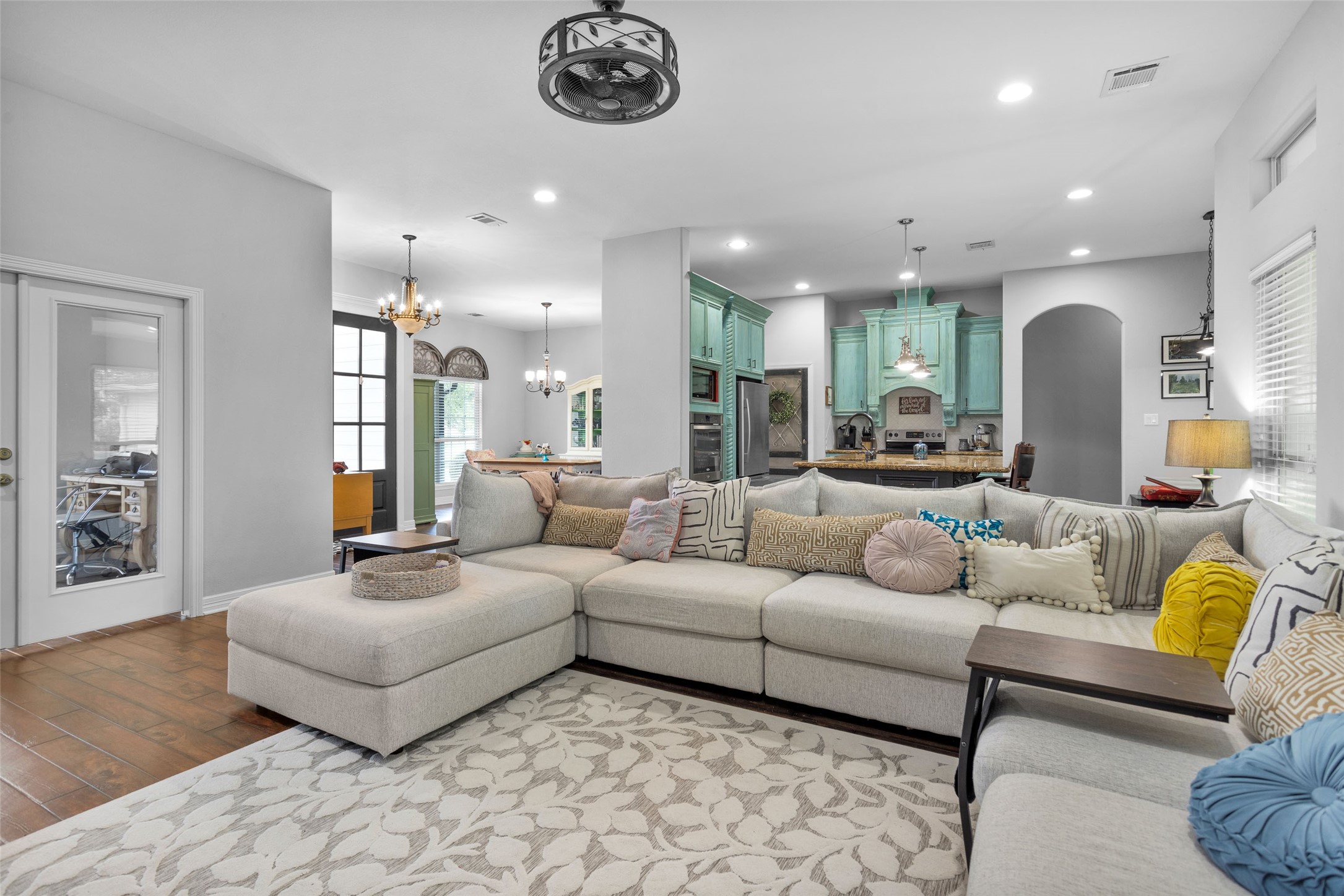 10810 Farrell Road Willis, TX 77378 - Photo 8 of 36 a living room with furniture and a chandelier