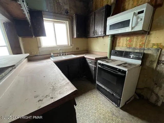 a kitchen with a stove and a sink