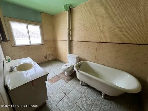 a bathroom with a sink and bathtub