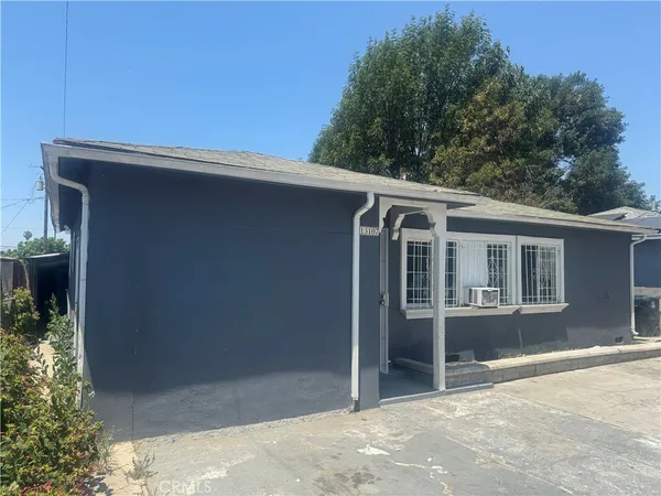 a large kitchen with stainless steel appliances granite countertop a large stove a sink dishwasher and a refrigerator with wooden floor