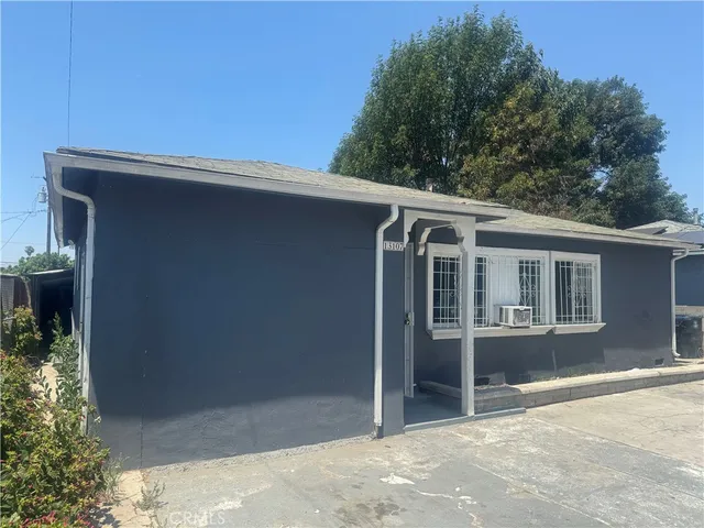 a large kitchen with stainless steel appliances granite countertop a large stove a sink dishwasher and a refrigerator with wooden floor