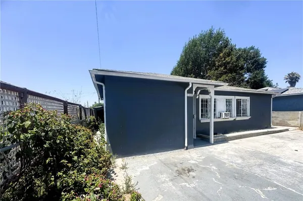 a large kitchen with stainless steel appliances granite countertop a large stove a sink dishwasher and a refrigerator with wooden floor