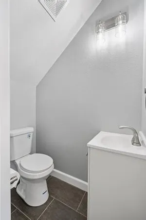 a bathroom with a toilet and a sink