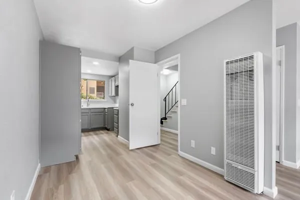 a view of a kitchen with a sink dishwasher and a refrigerator