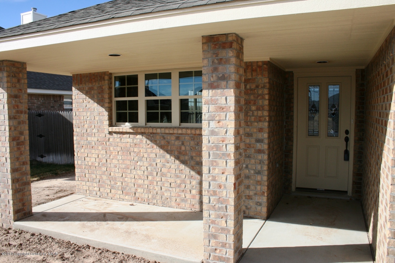 5804 South Rusk Street Amarillo, TX 79118 - Photo 2 of 18 a front view of a house with a glass door