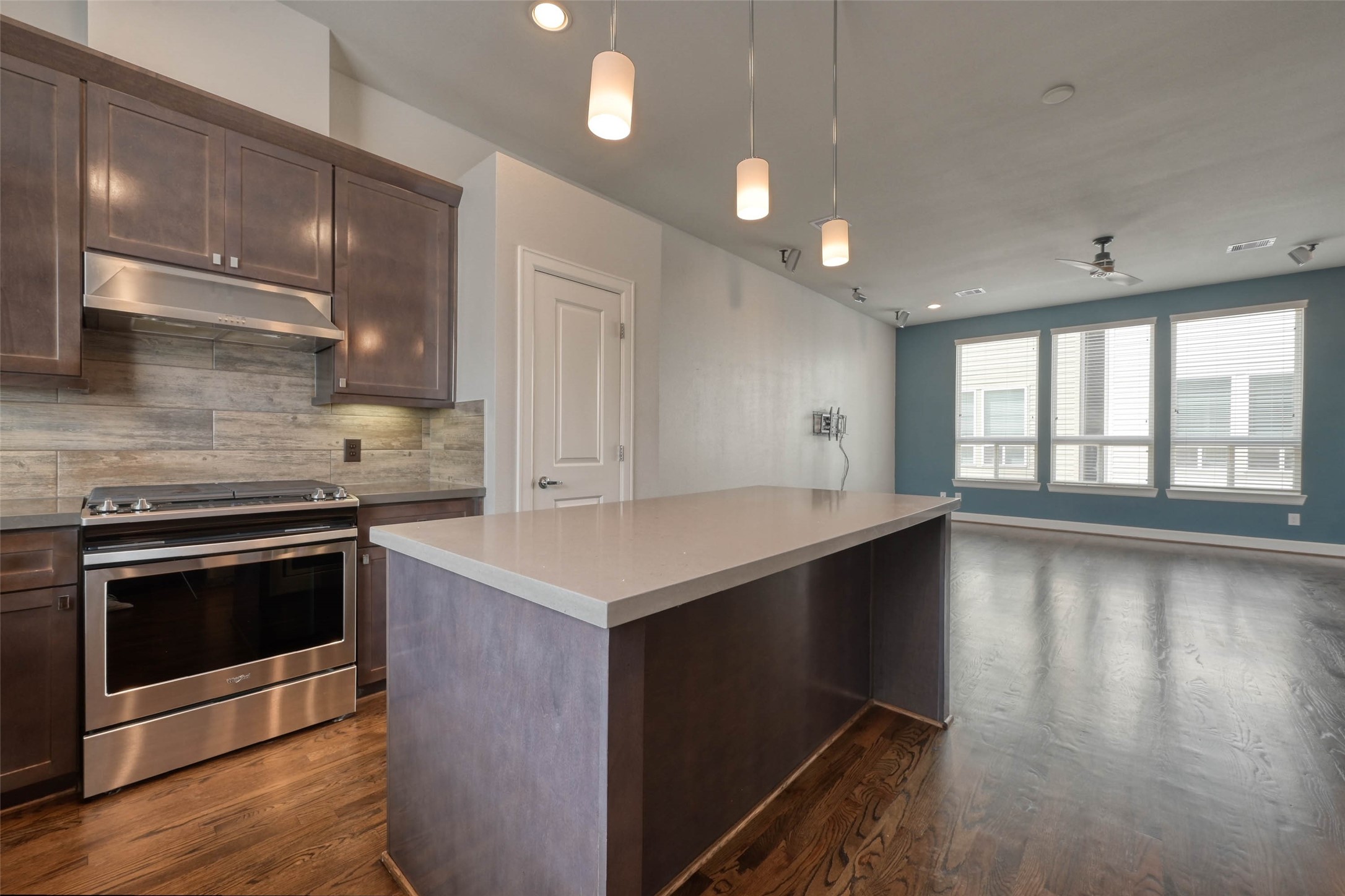 951 West 17th Street Houston, TX 77008 - Photo 15 of 30 a kitchen with granite countertop a stove and a wooden floors