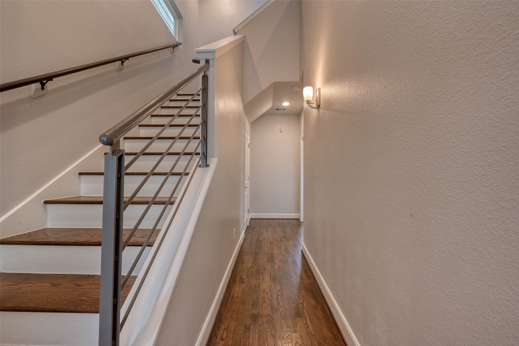 951 West 17th Street Houston, TX 77008 - Photo 5 of 30 a view of staircase with wooden floor and fan