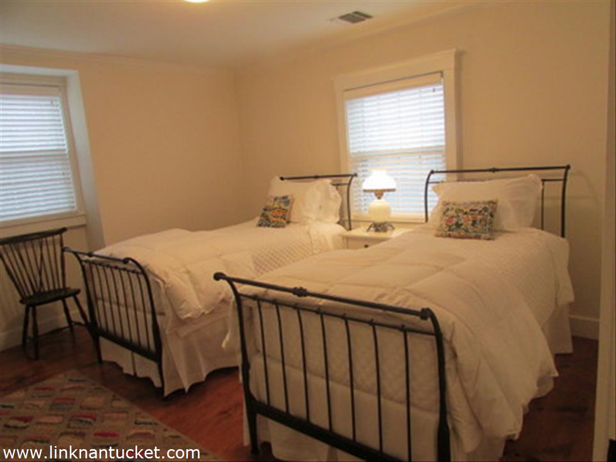 73 Fairgrounds Road Nantucket, MA 02554 - Photo 8 of 15 a bedroom with a bed and a window