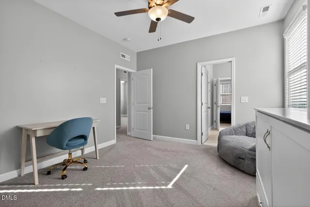 a bedroom with furniture and a window