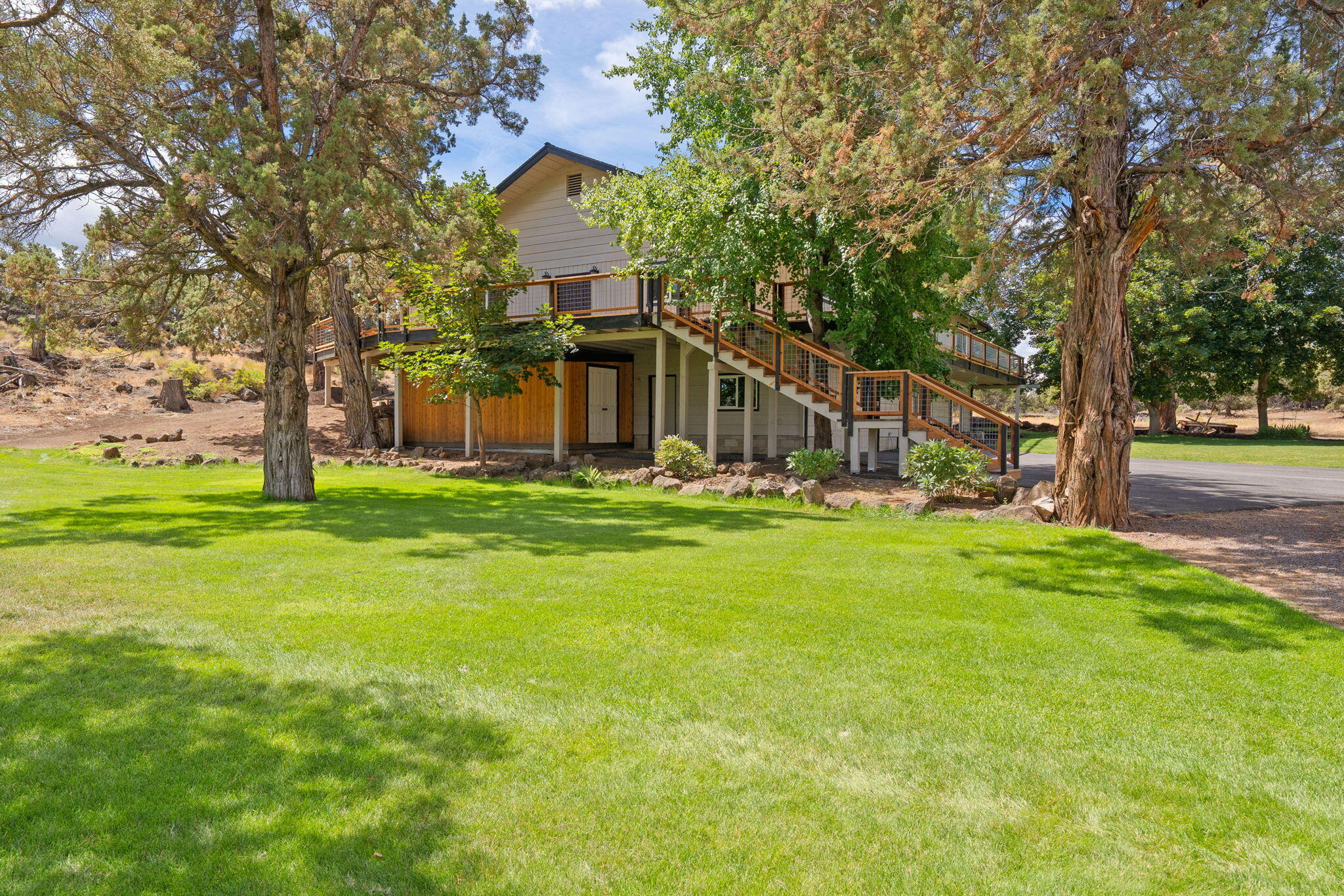 62155 Cody Road Bend, OR 97701 - Photo 49 of 61 a front view of a house with garden