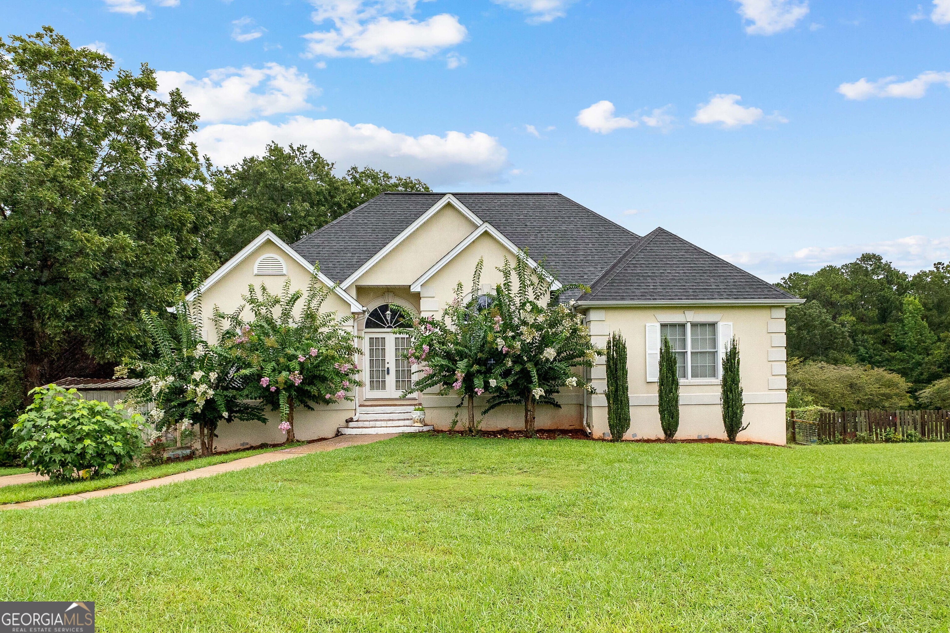 502 North Rover Road Williamson, GA 30292 - Photo 1 of 42 a view of a house with backyard and garden