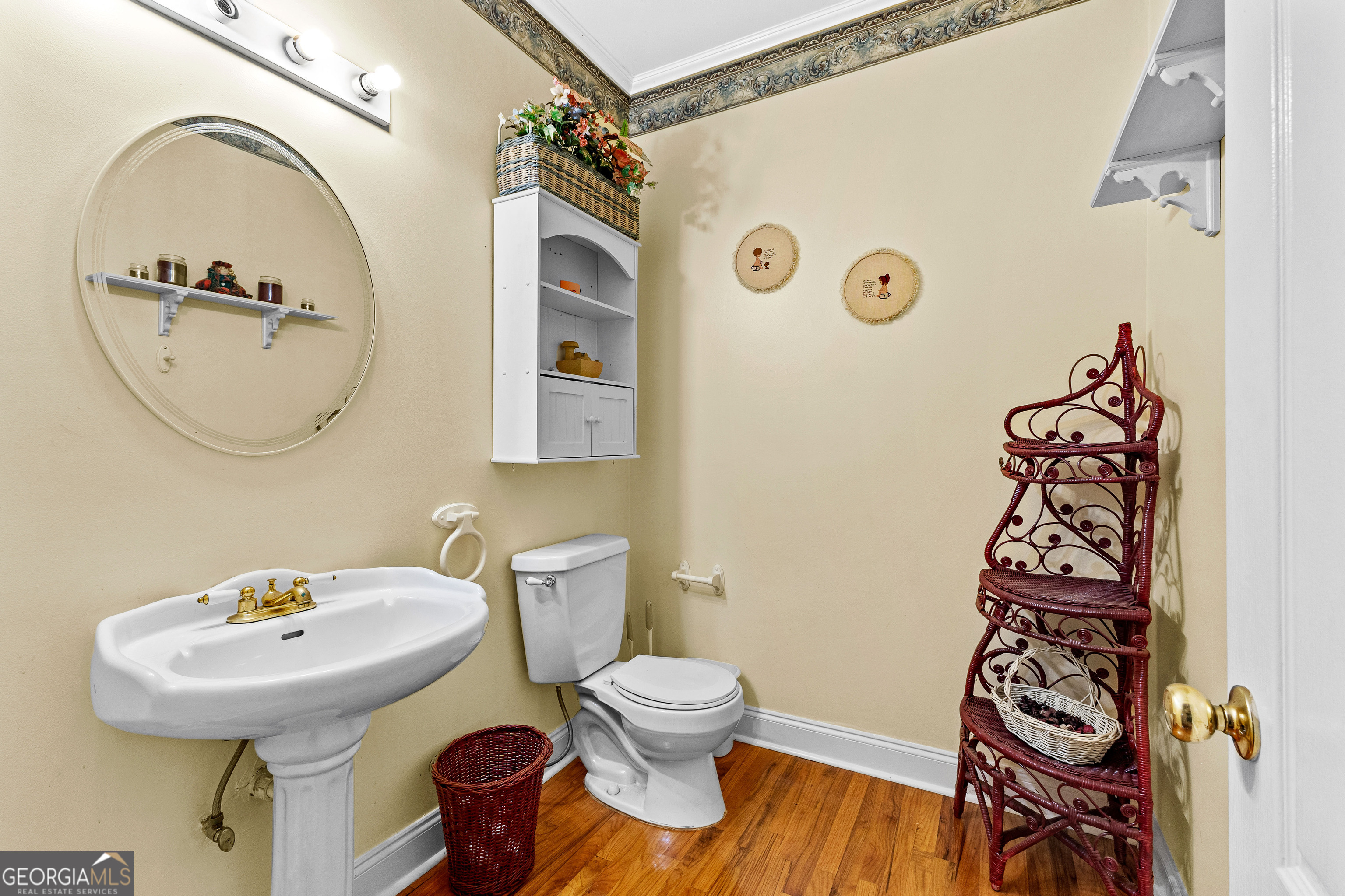 502 North Rover Road Williamson, GA 30292 - Photo 13 of 42 a bathroom with a toilet sink and mirror