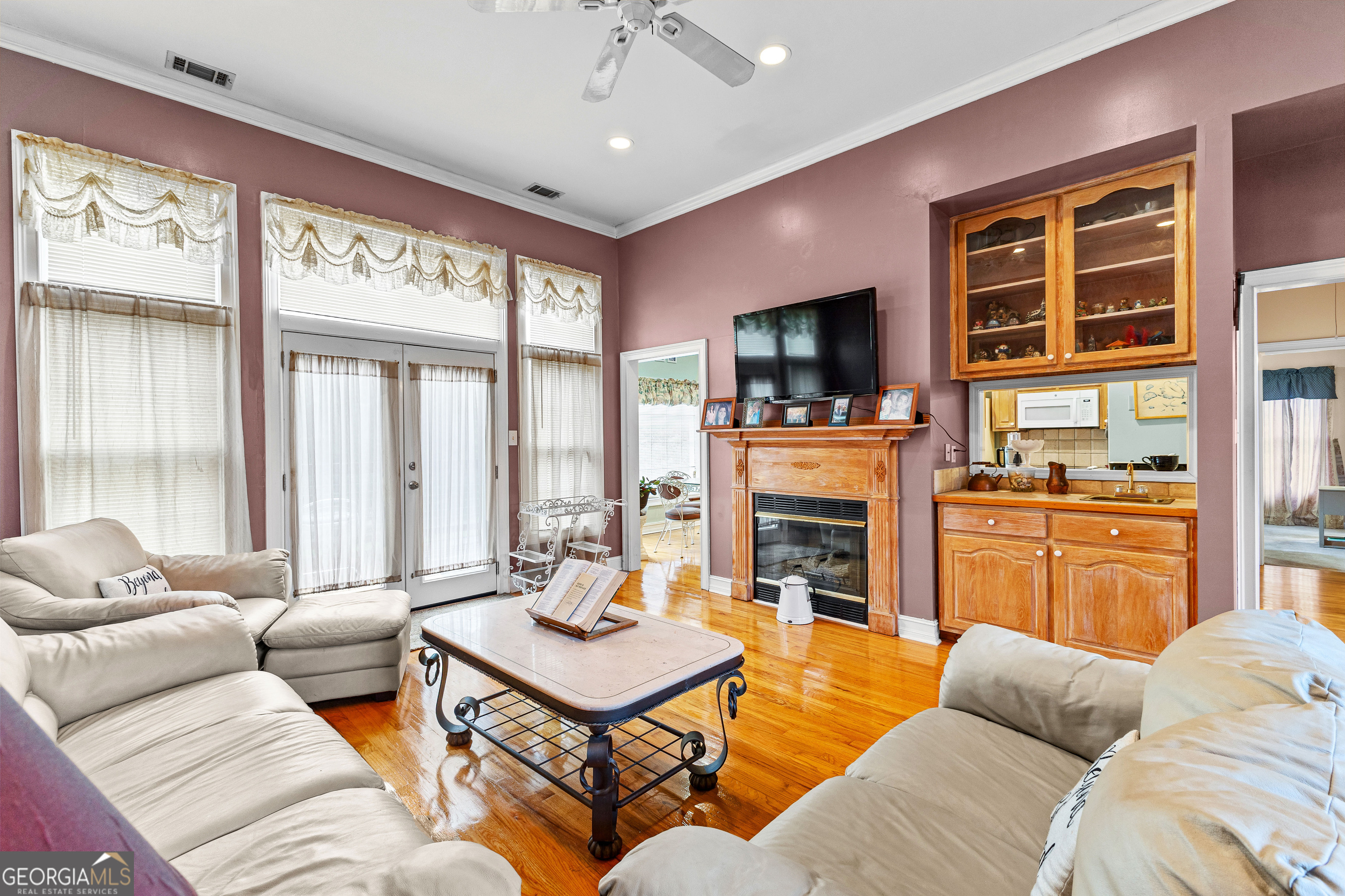 502 North Rover Road Williamson, GA 30292 - Photo 2 of 42 a living room with furniture fireplace and flat screen tv