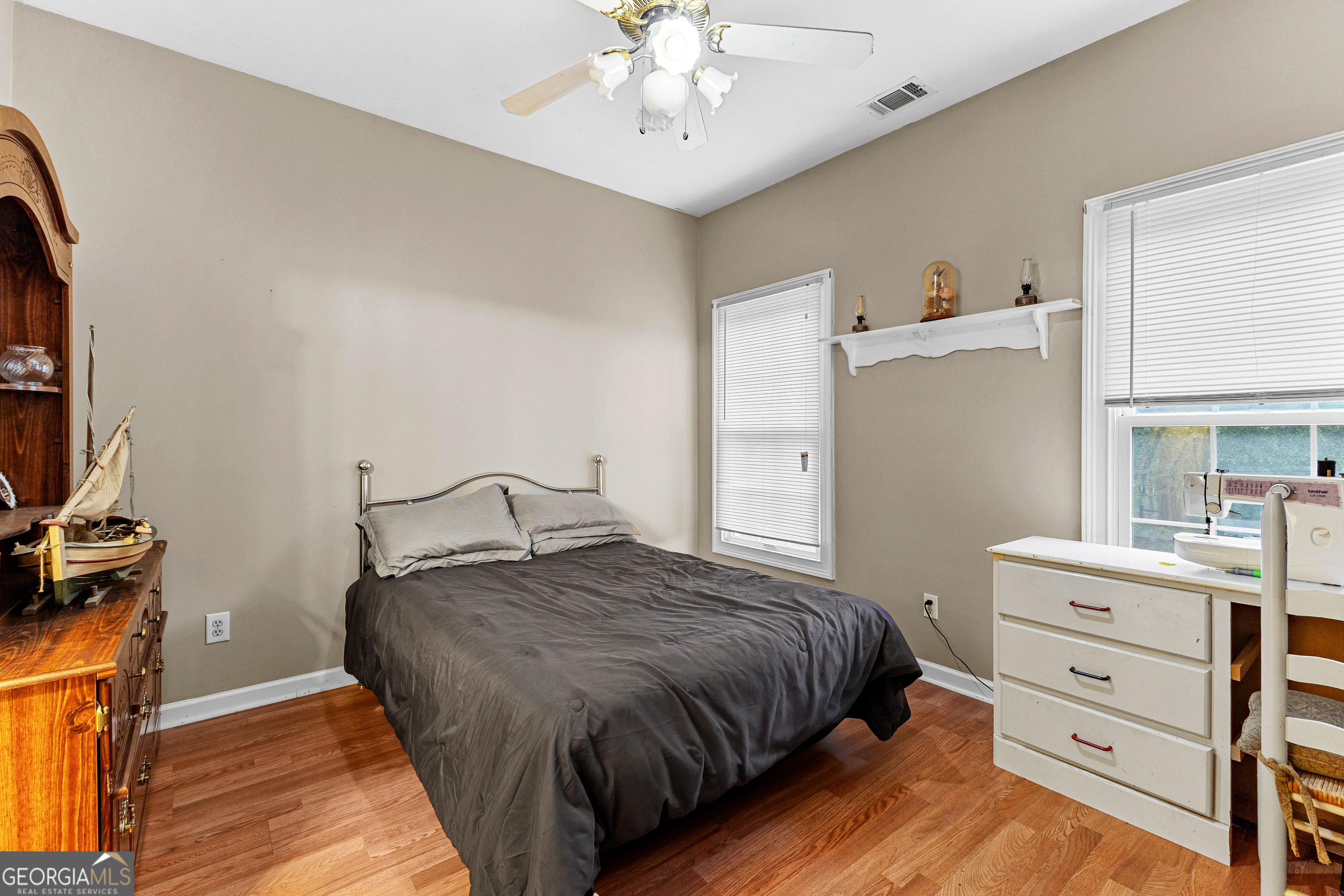 502 North Rover Road Williamson, GA 30292 - Photo 23 of 42 a bedroom with a bed and a dresser