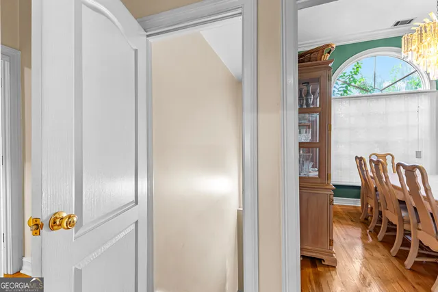 a view of dining room with furniture and wooden floor