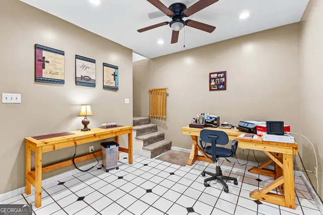 a view of a workspace with furniture