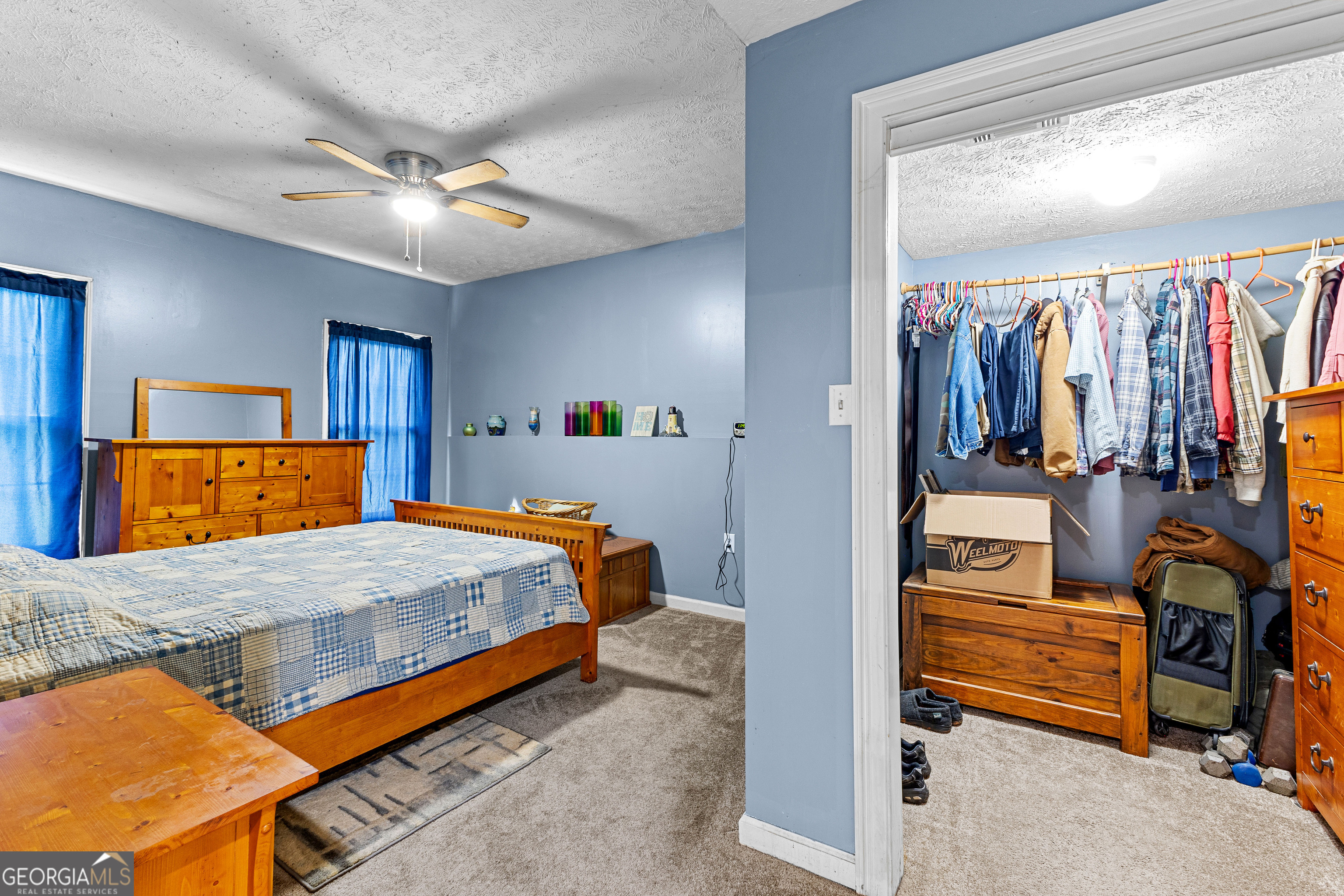 502 North Rover Road Williamson, GA 30292 - Photo 5 of 42 a bedroom with a bed and a walk in closet