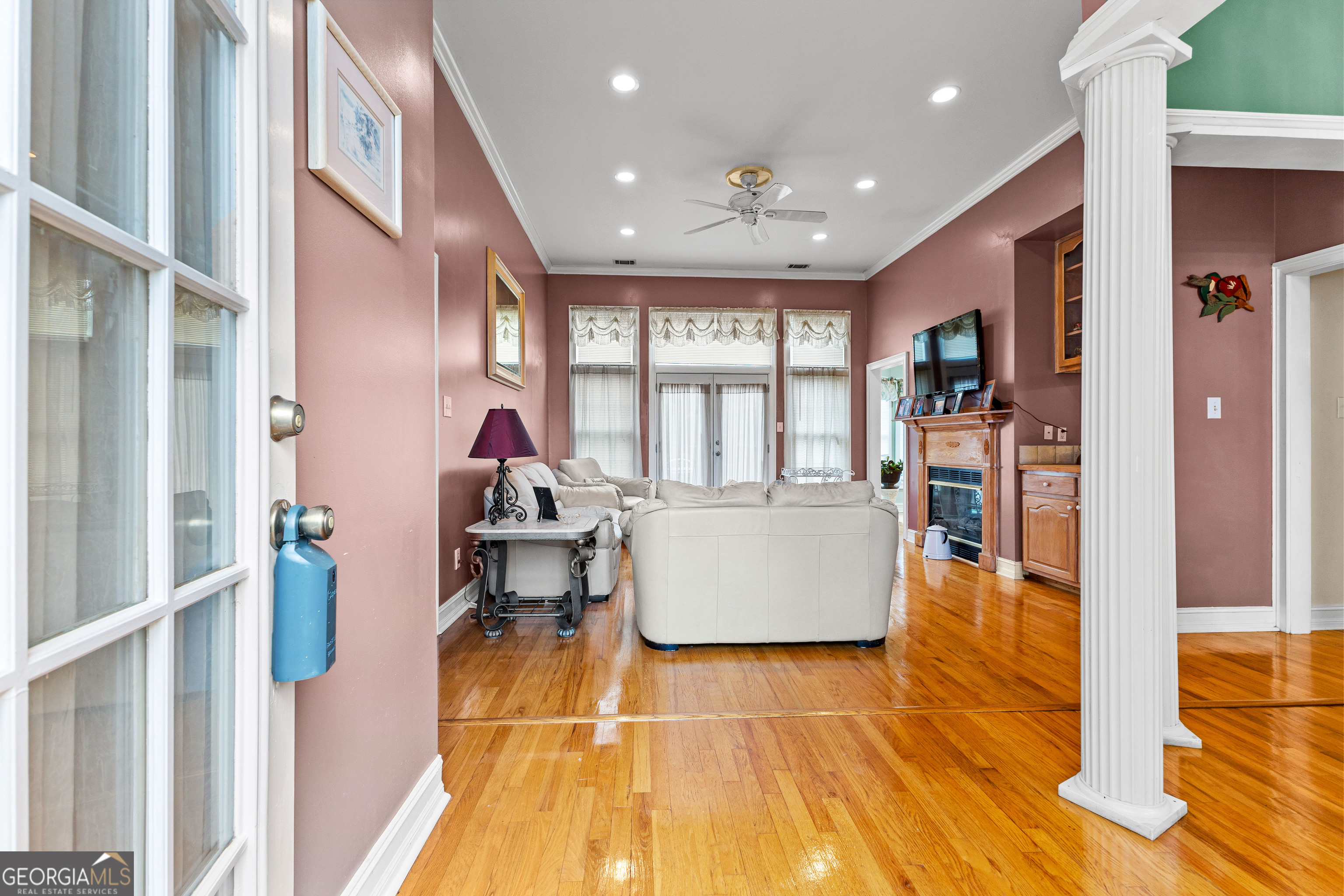 502 North Rover Road Williamson, GA 30292 - Photo 6 of 42 a living room with furniture and a table with wooden floor