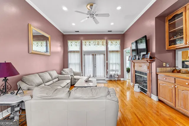 a living room with furniture fireplace and flat screen tv