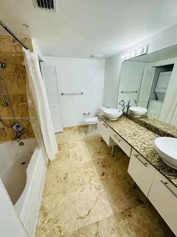 a bath tub sitting in a bathroom