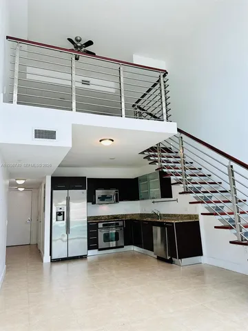 a kitchen with a cabinets and a stove