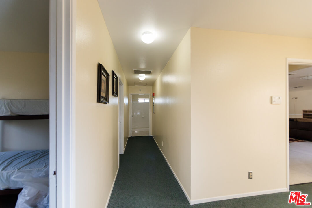 65675 Sullivan Road Joshua Tree, CA 92252 - Photo 12 of 54 a view of a hallway with a white walls