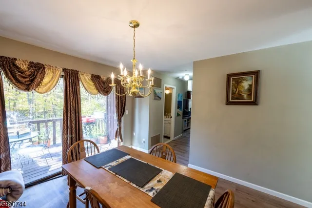 a bedroom with a bed mirror and a window