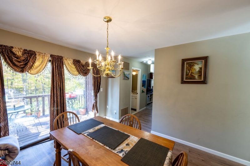 13 Village Way, Unit E7 Vernon, NJ 07462 - Photo 12 of 46 a view of a dining room with furniture window and outside view