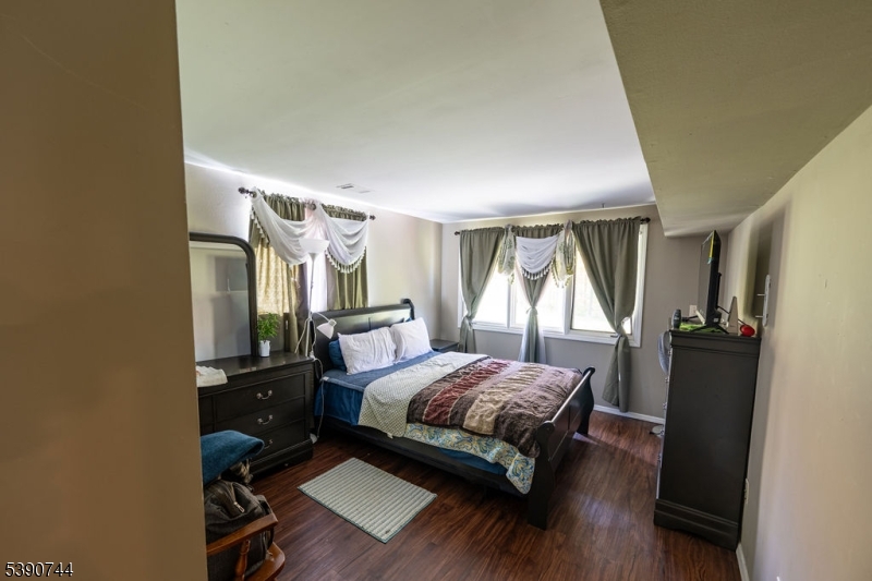 13 Village Way, Unit E7 Vernon, NJ 07462 - Photo 14 of 46 a bedroom with a bed window and a table