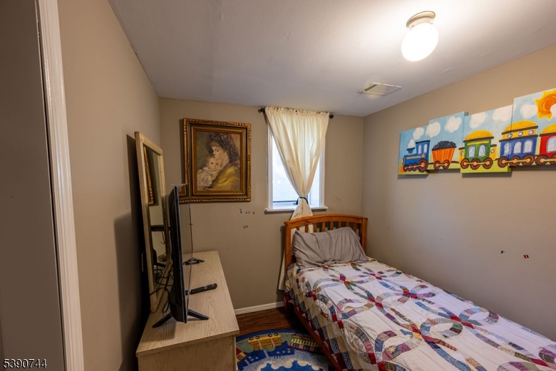 13 Village Way, Unit E7 Vernon, NJ 07462 - Photo 15 of 46 a bedroom with a bed and a window