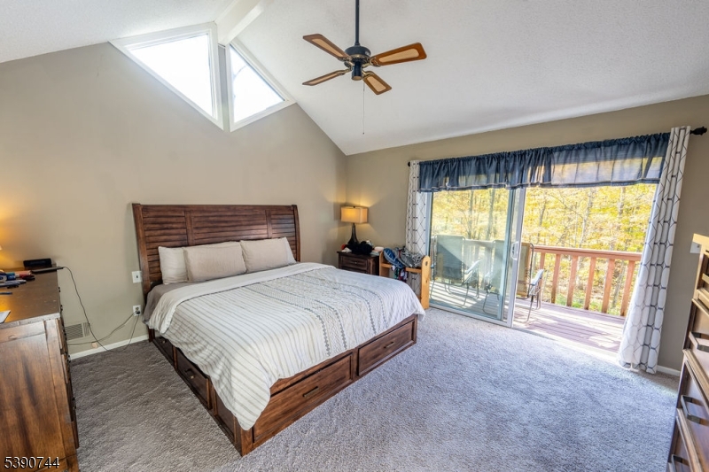 13 Village Way, Unit E7 Vernon, NJ 07462 - Photo 16 of 46 a spacious bedroom with a large bed and a large window