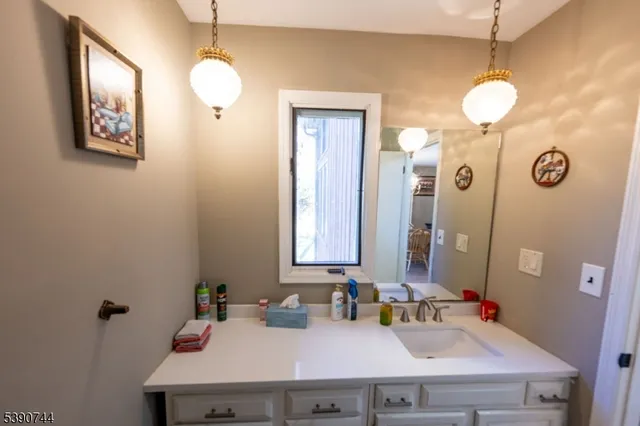 a bedroom with a bed and a mirror