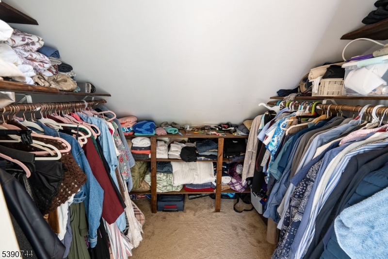 13 Village Way, Unit E7 Vernon, NJ 07462 - Photo 30 of 46 a view of walk in closet with clothes and shoes