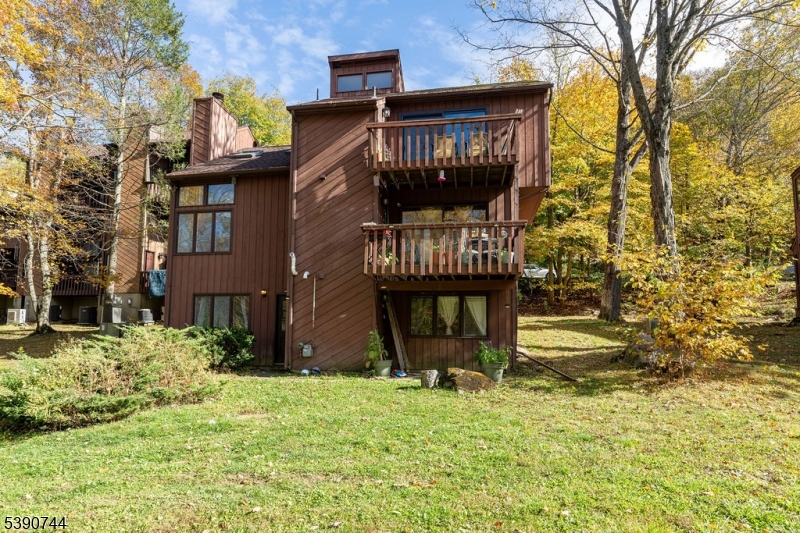 13 Village Way, Unit E7 Vernon, NJ 07462 - Photo 33 of 46 a front view of a house with a yard