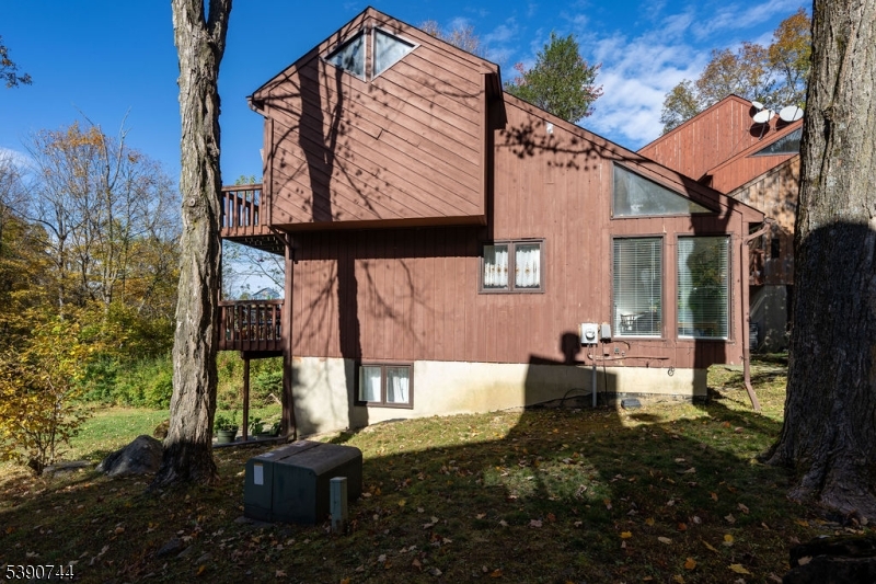 13 Village Way, Unit E7 Vernon, NJ 07462 - Photo 34 of 46 a view of a house with backyard and sitting area