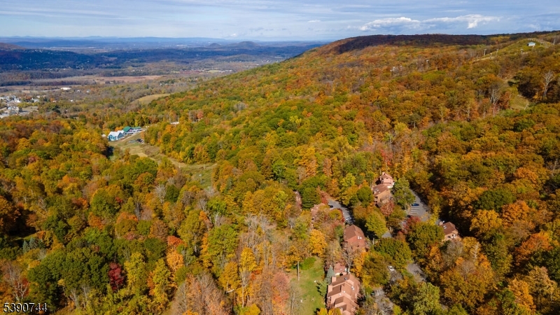 13 Village Way, Unit E7 Vernon, NJ 07462 - Photo 38 of 46 a view of a large yard with an outdoor space