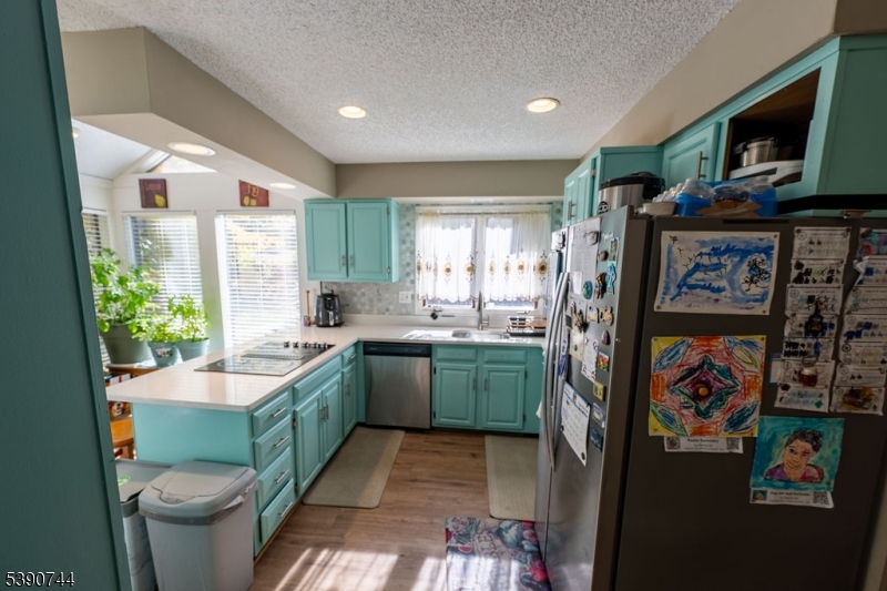 13 Village Way, Unit E7 Vernon, NJ 07462 - Photo 7 of 46 a kitchen with sink cabinets and appliances