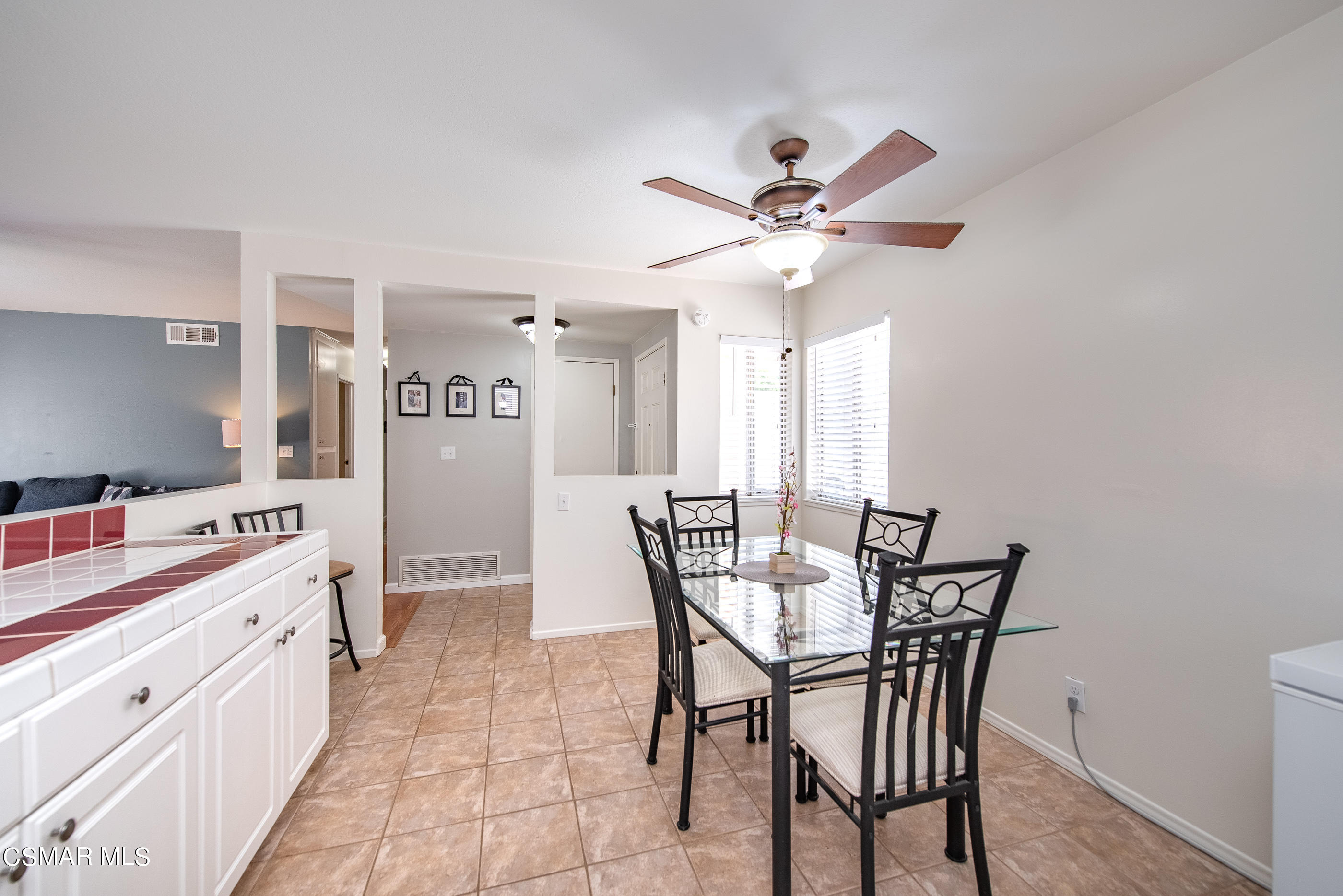 510 Appleton Road Simi Valley, CA 93065 - Photo 14 of 25 a view of a dining room with furniture and a chandelier fan