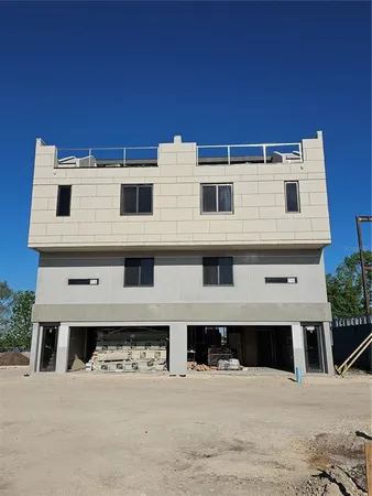 a view of a building with a yard