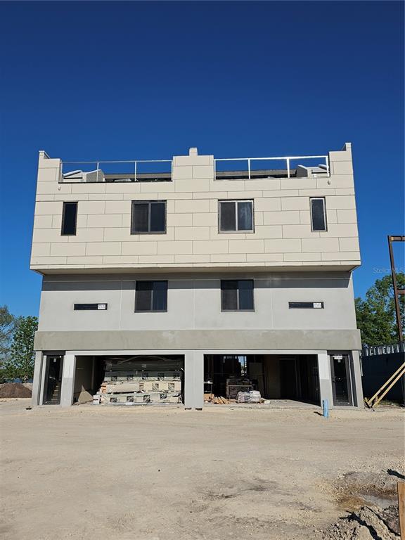 a view of a building with a yard