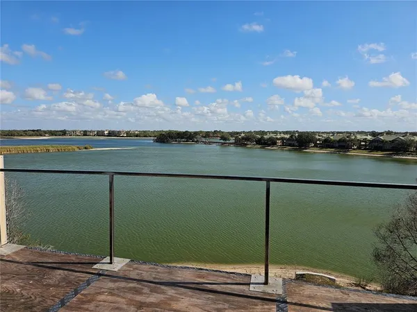 a view of a lake from a balcony