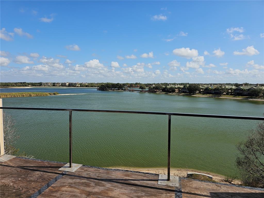 10775 Rodeo Drive, Unit MODEL Lakewood Ranch, FL 34202 - Photo 2 of 12 a view of a lake from a balcony
